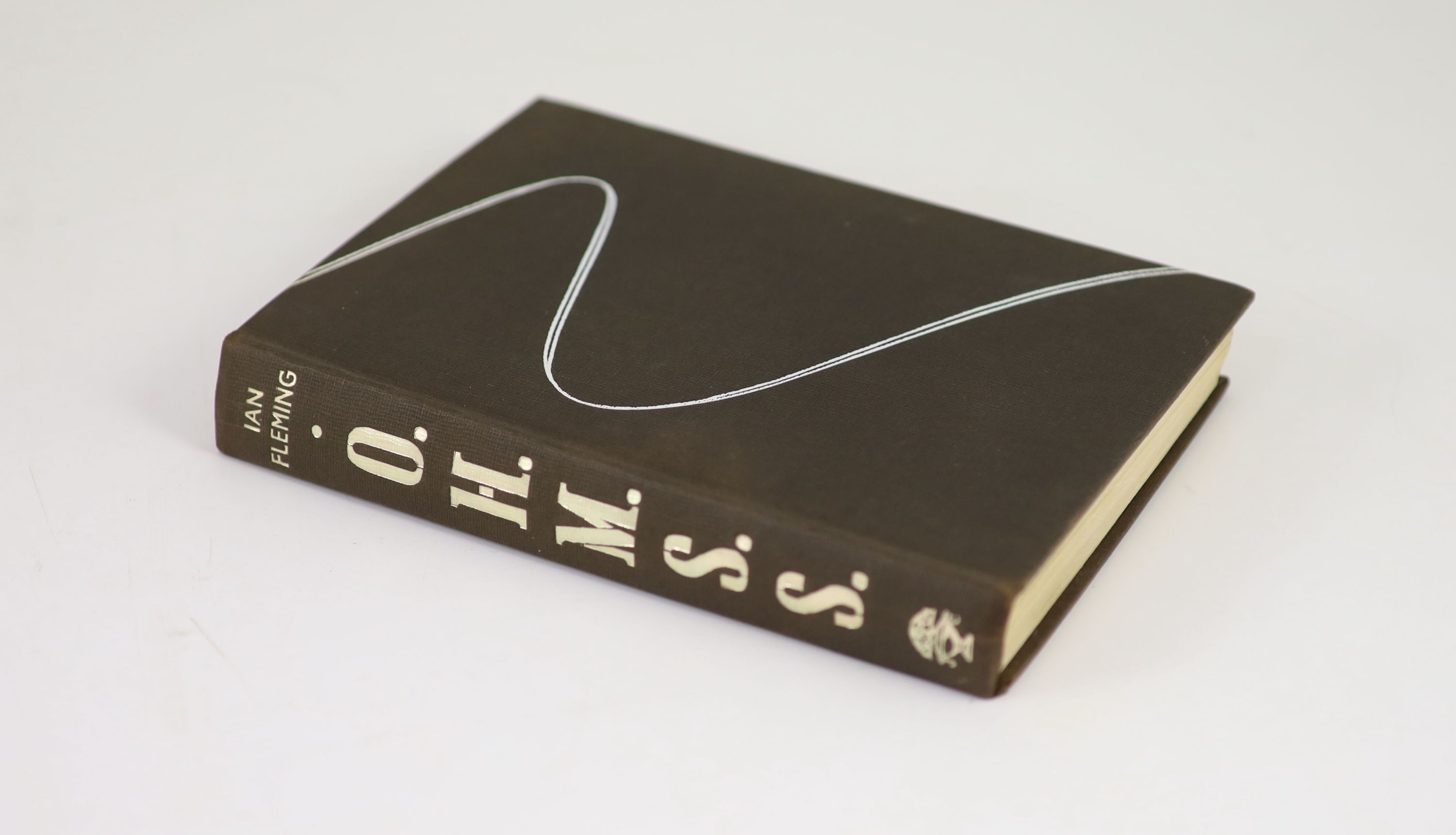 Fleming, Ian - On Her Majesty’s Secret Service, 1st edition, 8vo, black cloth, with white ‘’ski-track’’ motif, with torn and sunned unclipped d/j, owners inscription to front fly-leaf, Jon Cape, London, 1963
